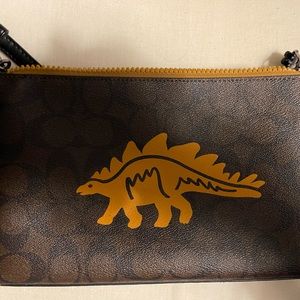 Small Coach purse with dinosaur